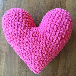 Pink heart-shaped decorative pillow